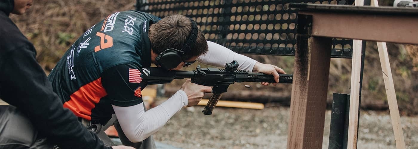 Competition shooter using a 9mm carbine