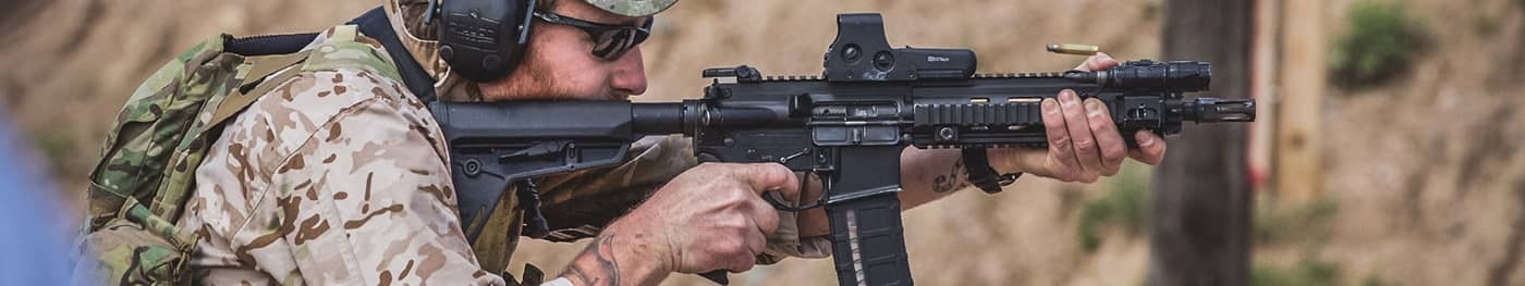 Man firing with C clamp grip