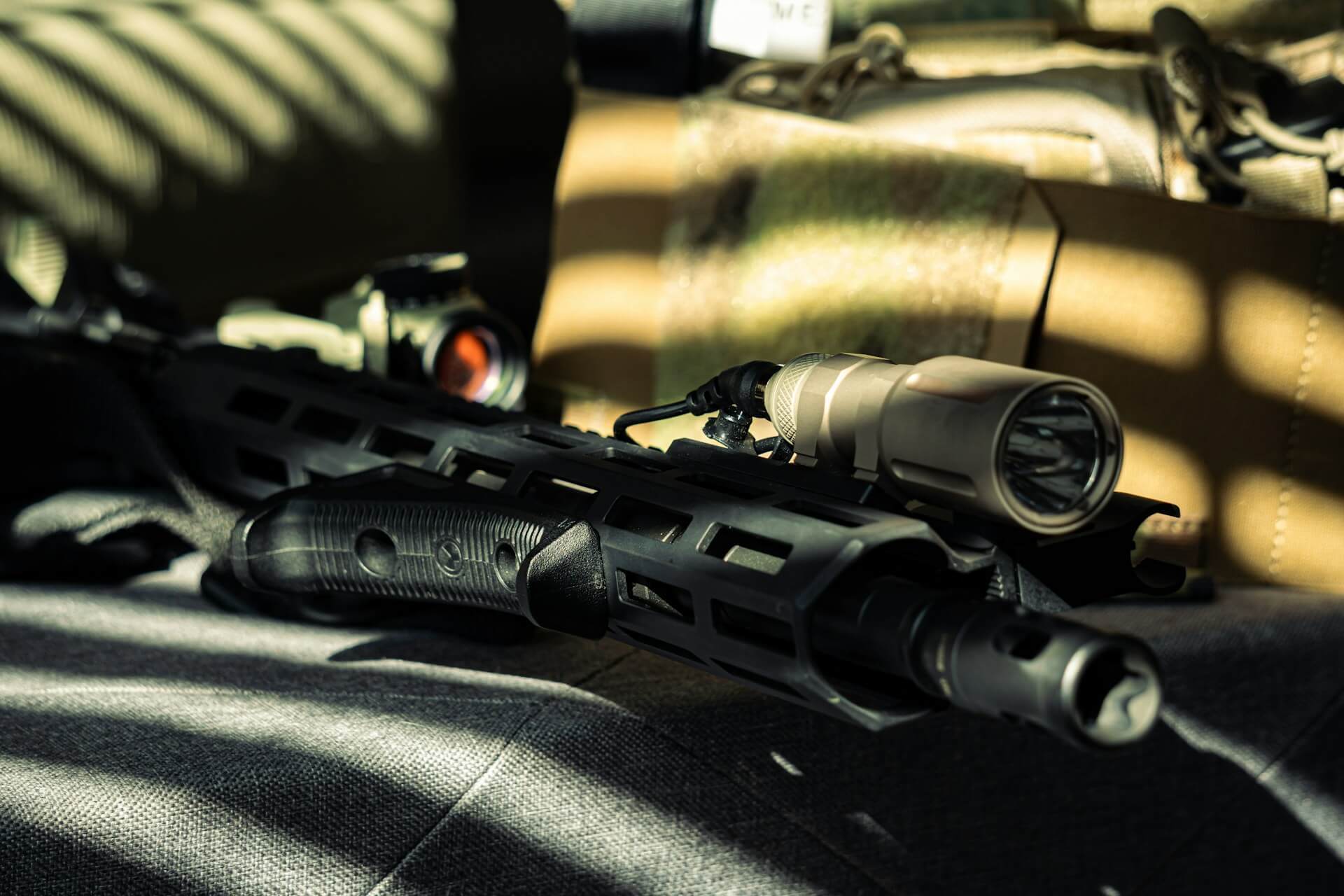 Rifle with red dot and flashlight