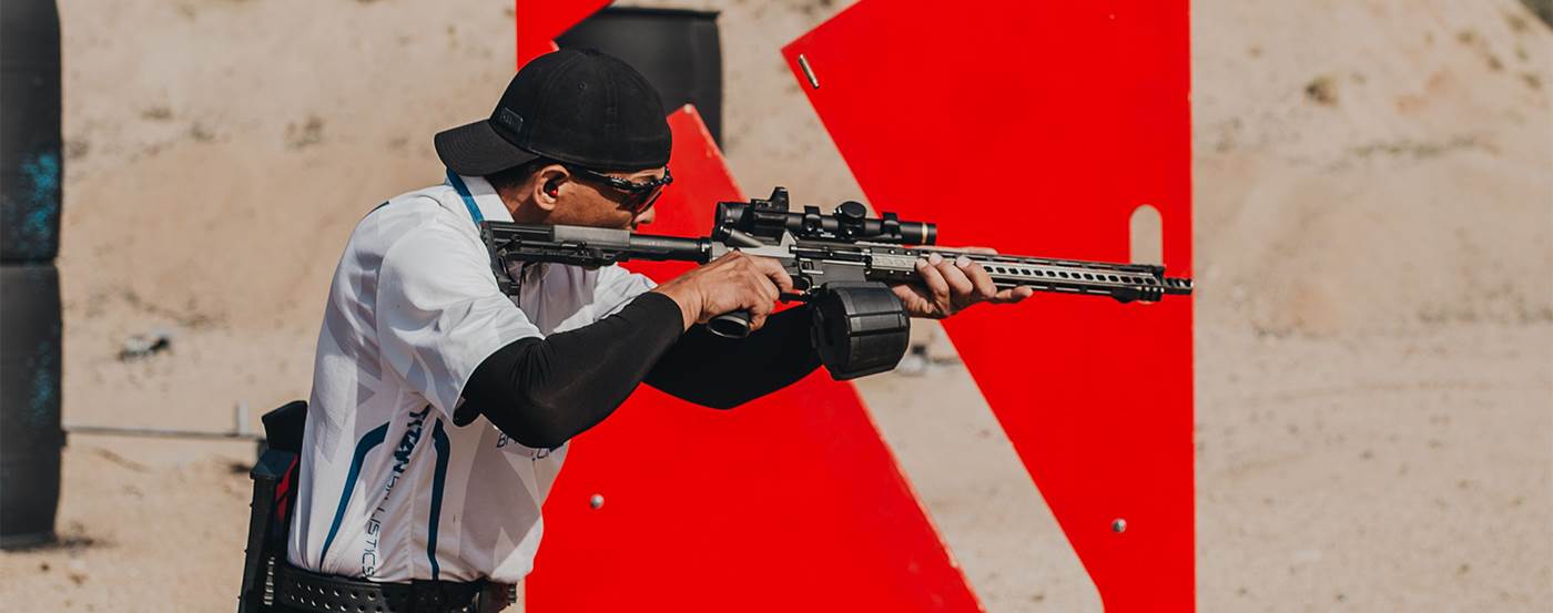 Shooter using offset red dot sight in shooting competition